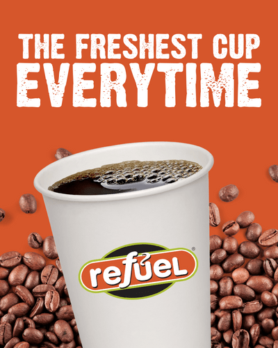 The freshest cup of coffee, every time, coffee cup with roast beans in background.