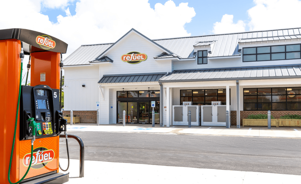 Refuel storefront with gas pump on the left side.